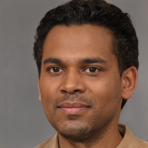 Neutral black young-adult male with short  black hair and brown eyes