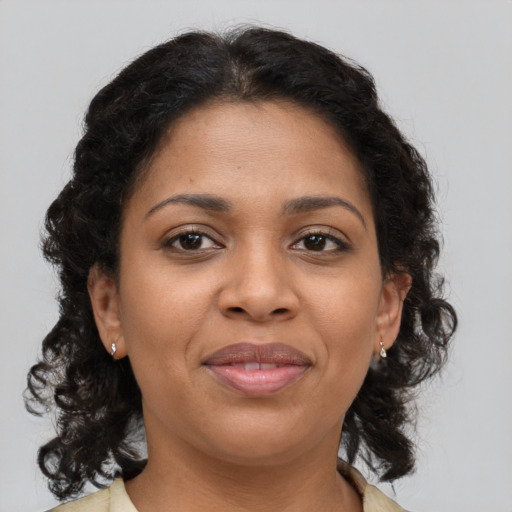 Joyful black young-adult female with medium  brown hair and brown eyes