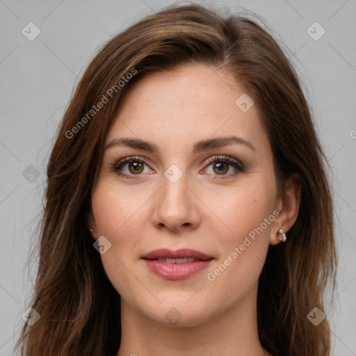 Joyful white young-adult female with long  brown hair and green eyes