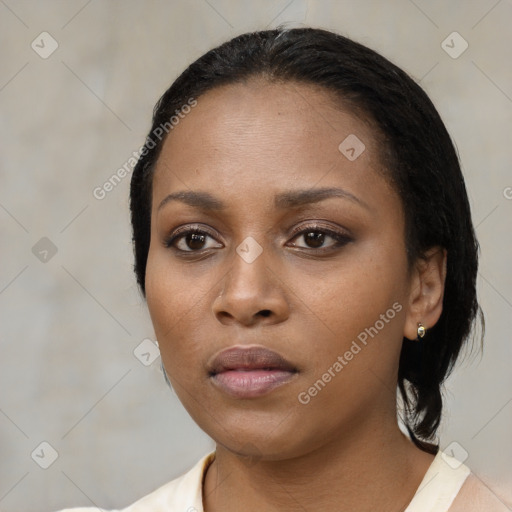 Neutral black young-adult female with medium  black hair and brown eyes