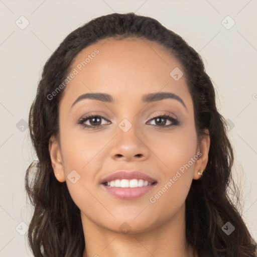 Joyful latino young-adult female with long  brown hair and brown eyes