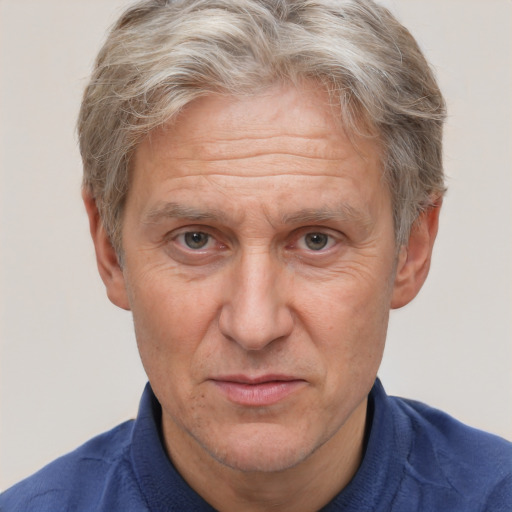 Joyful white middle-aged male with short  brown hair and brown eyes