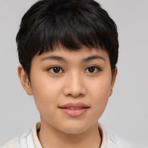 Joyful asian young-adult female with short  brown hair and brown eyes