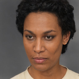 Neutral black adult female with short  black hair and brown eyes