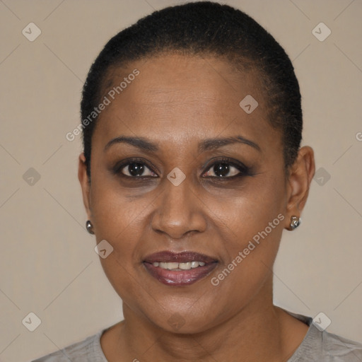 Joyful black adult female with short  brown hair and brown eyes