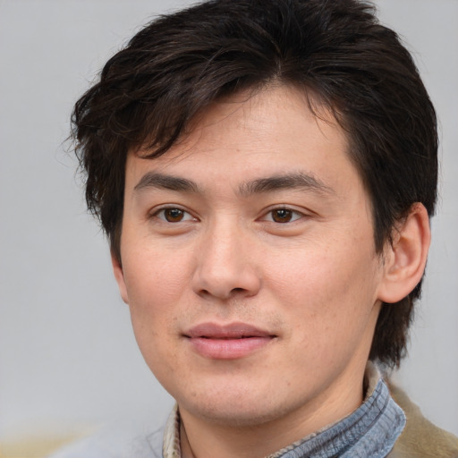 Joyful white young-adult male with medium  brown hair and brown eyes