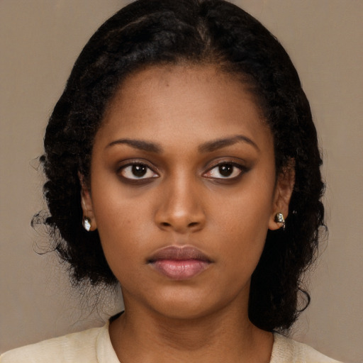 Neutral black young-adult female with medium  black hair and brown eyes