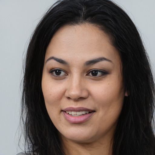 Joyful asian young-adult female with long  brown hair and brown eyes