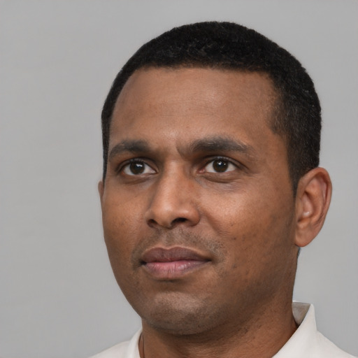 Neutral black adult male with short  black hair and brown eyes