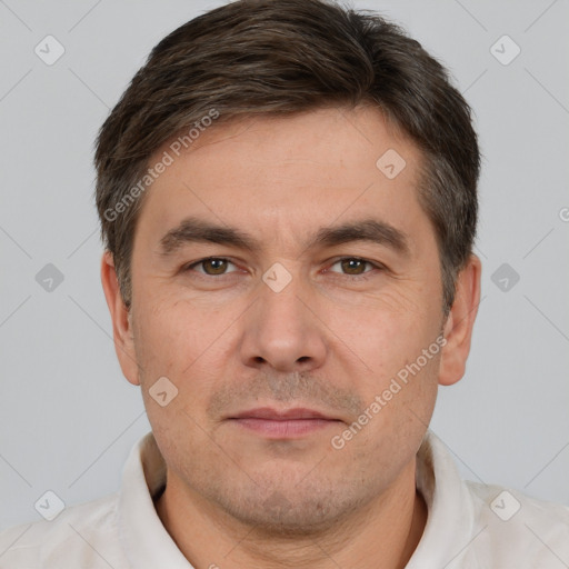 Joyful white adult male with short  brown hair and brown eyes