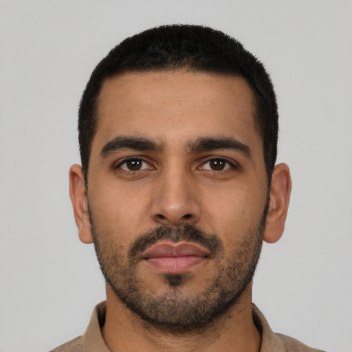 Neutral latino young-adult male with short  black hair and brown eyes