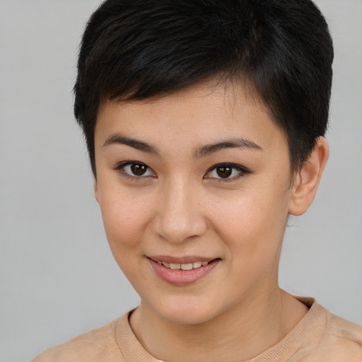 Joyful asian young-adult female with short  brown hair and brown eyes