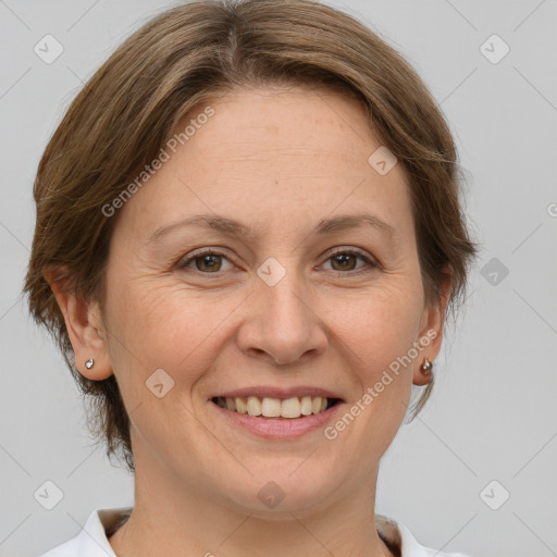 Joyful white adult female with short  brown hair and grey eyes