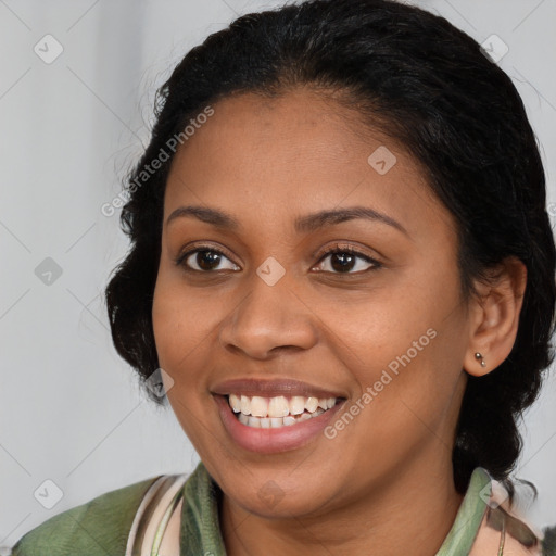 Joyful latino young-adult female with medium  brown hair and brown eyes