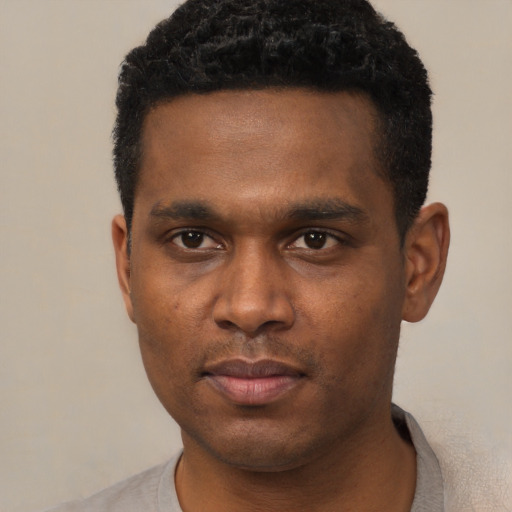 Neutral black young-adult male with short  black hair and brown eyes