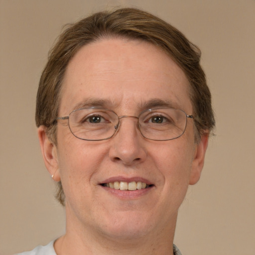 Joyful white adult male with short  brown hair and green eyes