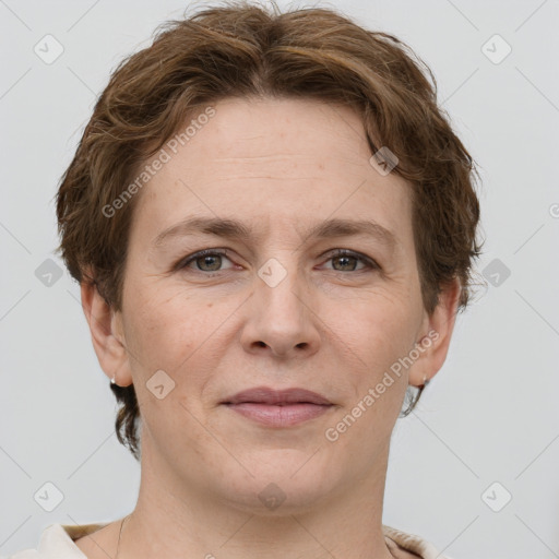 Joyful white adult female with short  brown hair and grey eyes