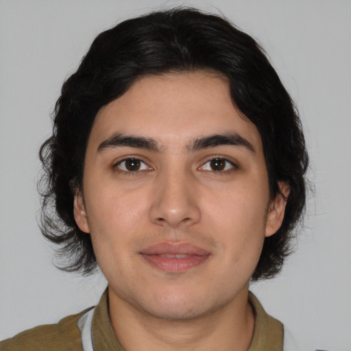 Joyful white young-adult male with medium  brown hair and brown eyes