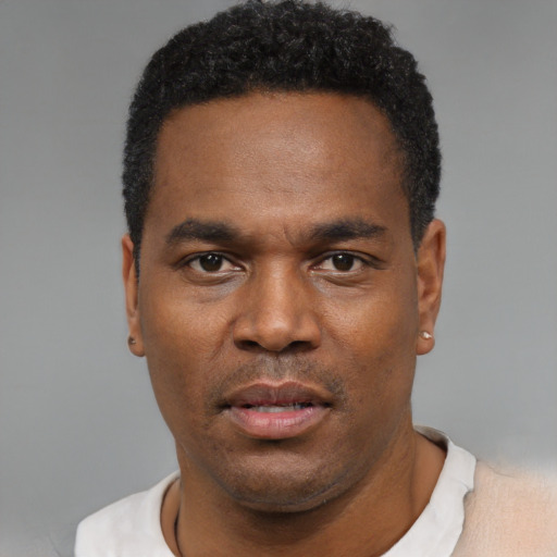 Neutral black young-adult male with short  black hair and brown eyes