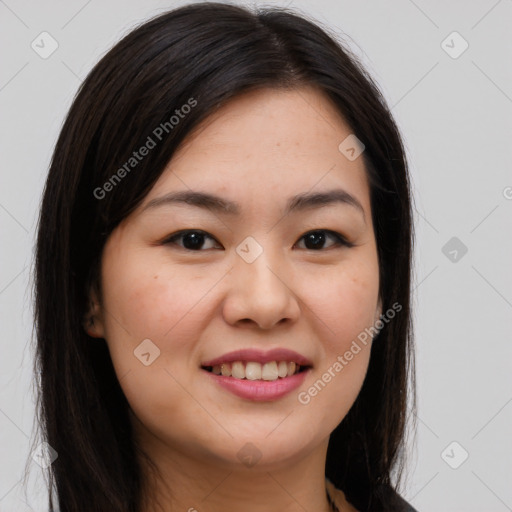 Joyful asian young-adult female with long  brown hair and brown eyes