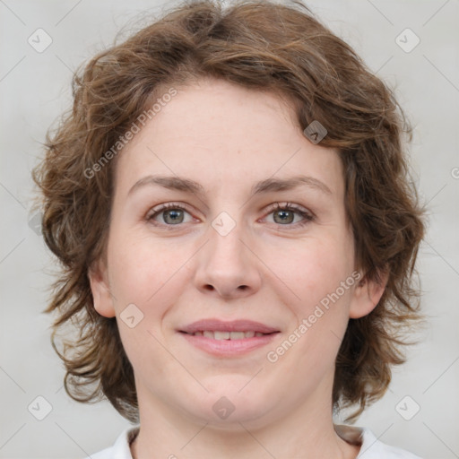 Joyful white young-adult female with medium  brown hair and green eyes