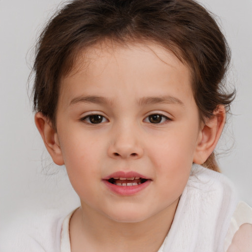 Joyful white child female with medium  brown hair and brown eyes