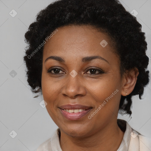 Joyful black adult female with short  brown hair and brown eyes