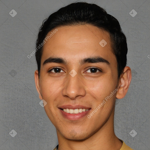 Joyful white young-adult male with short  black hair and brown eyes