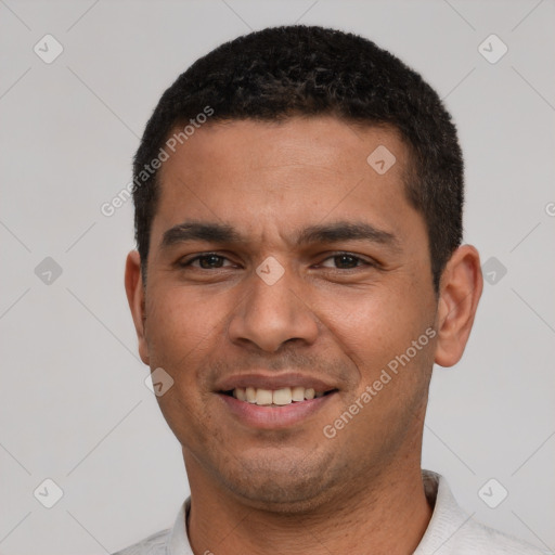 Joyful white young-adult male with short  black hair and brown eyes