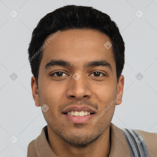 Joyful latino young-adult male with short  black hair and brown eyes