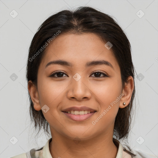 Joyful latino young-adult female with medium  brown hair and brown eyes