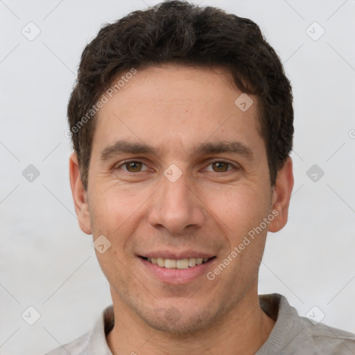 Joyful white adult male with short  brown hair and brown eyes