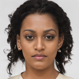 Neutral black young-adult female with long  brown hair and brown eyes