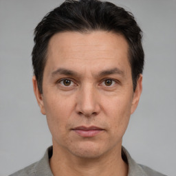 Neutral white adult male with short  black hair and brown eyes