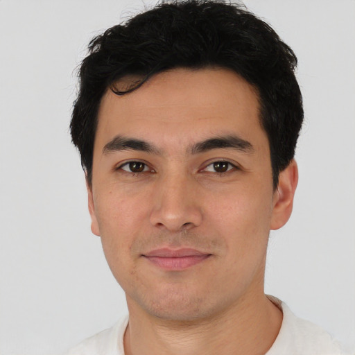Joyful asian young-adult male with short  black hair and brown eyes