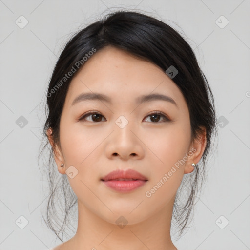 Joyful asian young-adult female with medium  black hair and brown eyes