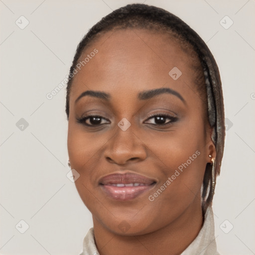 Joyful black young-adult female with short  brown hair and brown eyes