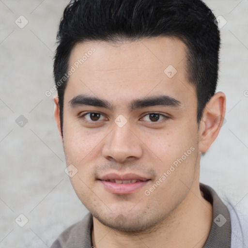 Joyful white young-adult male with short  black hair and brown eyes