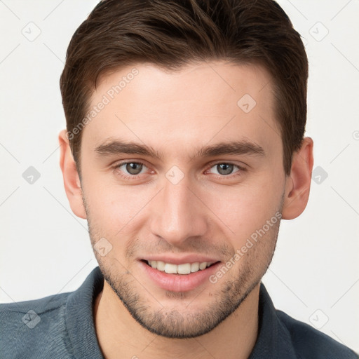 Joyful white young-adult male with short  brown hair and brown eyes