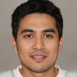 Joyful asian young-adult male with short  black hair and brown eyes