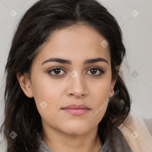 Joyful latino young-adult female with long  brown hair and brown eyes