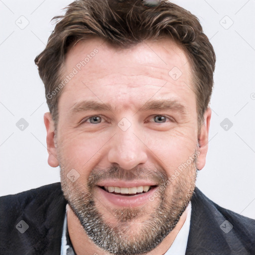 Joyful white adult male with short  brown hair and grey eyes