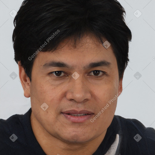 Joyful asian young-adult male with short  brown hair and brown eyes