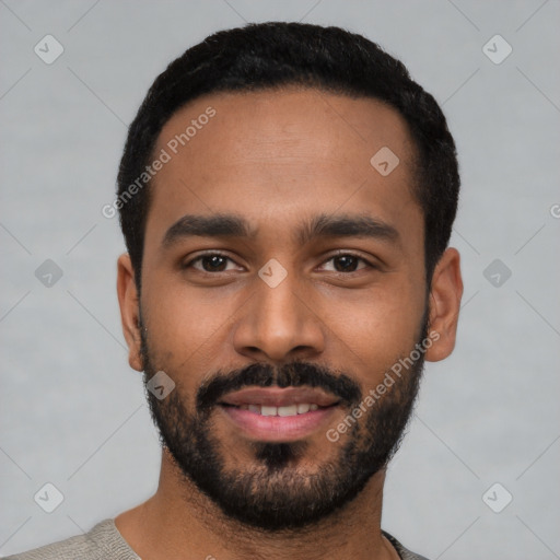 Joyful black young-adult male with short  black hair and brown eyes