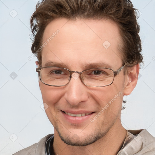 Joyful white adult male with short  brown hair and grey eyes