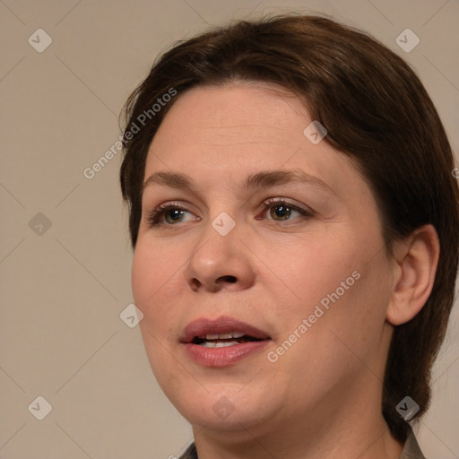 Joyful white adult female with medium  brown hair and brown eyes