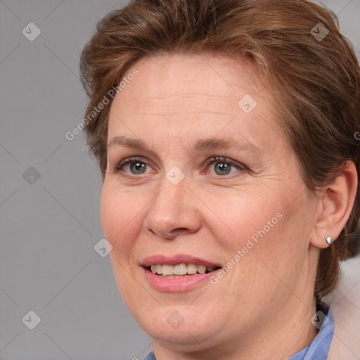 Joyful white adult female with medium  brown hair and blue eyes