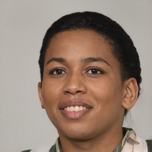 Joyful latino young-adult female with short  black hair and brown eyes