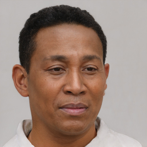 Neutral latino adult male with short  brown hair and brown eyes