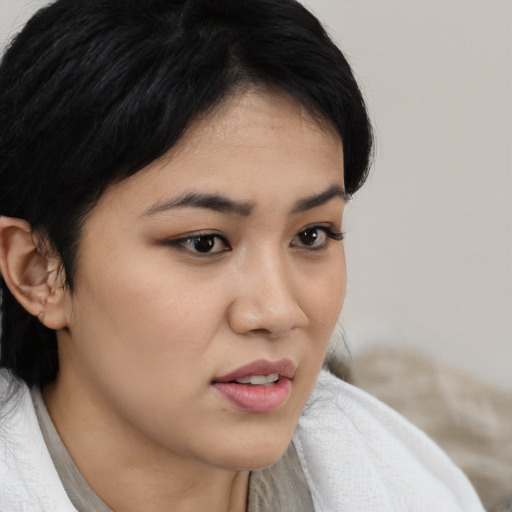 Neutral asian young-adult female with medium  brown hair and brown eyes